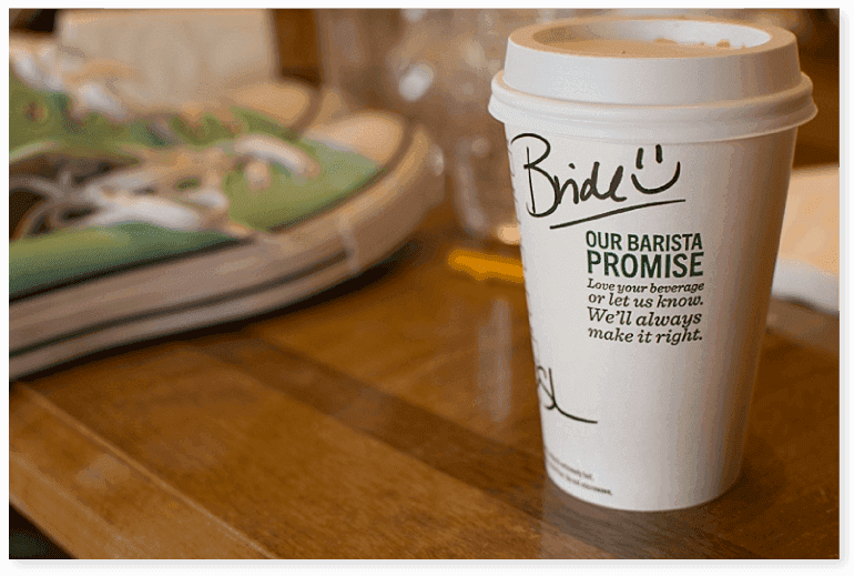 Starbucks cup with barista signature